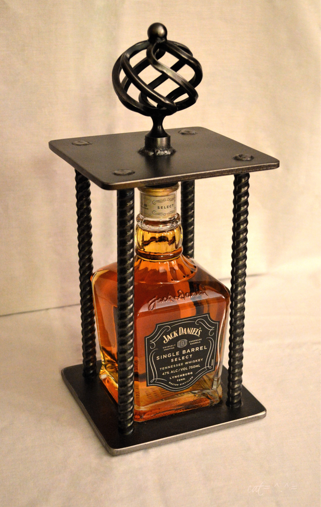 whiskey bottle in a cage